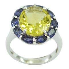 Lily multicolor cocktail ring with a large yellow center stone surrounded by smaller blue gemstones