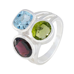 Chloe multicolor gemstone cocktail ring with blue, green, and red gemstones in silver setting