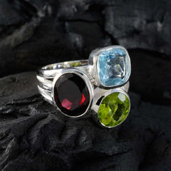 Chloe multicolor gemstone cocktail ring with blue, red, and green stones set in silver band
