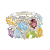 Dewi multicolor gemstone cocktail ring featuring various oval and pear-shaped gemstones with silver setting