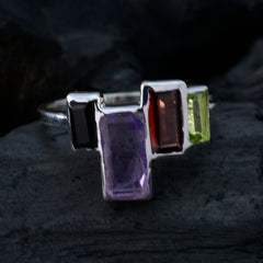 multicolor gemstone cocktail ring with silver band and rectangular onyx amethyst garnet peridot stones