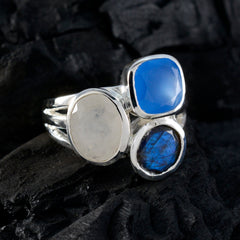 Constanza multicolor gemstone cocktail ring with blue and silver stones on black background