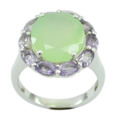 Constanza multicolor gemstone cocktail ring with a large green center stone surrounded by purple gemstones