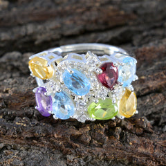 Dewi multicolor gemstone cocktail ring with blue, yellow, red, green, and purple stones set in silver