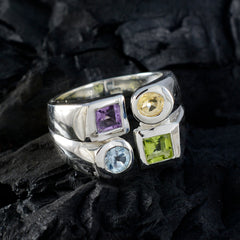 Nora multicolor gemstone cocktail ring with purple, yellow, blue, and green stones set in silver