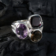 Siti multicolor gemstone cocktail ring with purple, black, and brown stones set in silver band