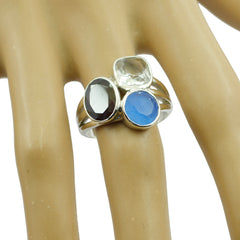 Isabella multicolor gemstone cocktail ring sterling silver three stone blue red and clear gemstones on mannequin hand