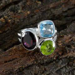 Chloe multicolor gemstone cocktail ring with red, blue, and green stones set in silver band