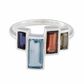 Dewi multicolor gemstone cocktail ring with rectangular blue, purple, red, and gray stones in silver band