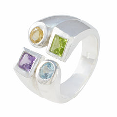 Nora multicolor gemstone cocktail ring with silver band featuring yellow, green, purple, and blue stones