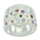 Micaela multicolor gemstone cocktail ring with various colorful stones set on wide silver band