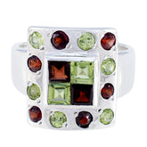 Harper multicolor gemstone cocktail ring in polished silver with square green and red center stones and surrounding round stones