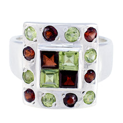 Harper multicolor gemstone cocktail ring in polished silver with square green and red center stones and surrounding round stones