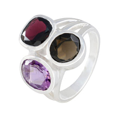 Siti multicolor gemstone cocktail ring with purple, red, and brown gemstones set in silver band
