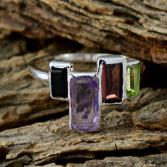 Haeun sterling silver multicolor gemstone cocktail ring with rectangular amethyst garnet peridot on wood