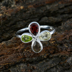 Emi multicolor gemstone floral ring with pear shaped red green and pale yellow stones on a silver band
