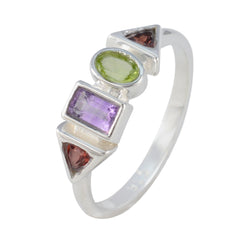 Angel multicolor gemstone ring with green oval, purple rectangular, and red triangular stones in silver setting