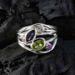 Liyana multicolor gemstone ring with green, purple, and clear stones set in silver band