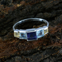 Chen multicolor gemstone ring for women in silver band with square blue center stone and flanking light blue and yellow gems
