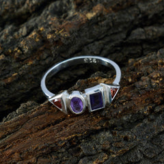 Ling sterling silver 925 multicolor gemstone ring with oval and square purple stones and red accents on wood