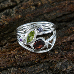 Meera multicolor gemstone ring with green, red, purple, and blue stones set in silver band