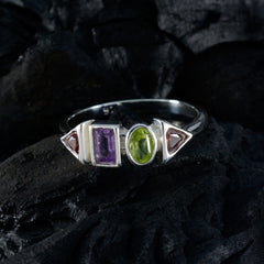 Angel multicolor gemstone ring with purple, green, and pink stones set in silver band
