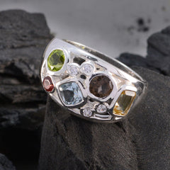 Isabelle multicolor gemstone ring with green, red, blue, brown, and yellow stones set in silver band