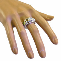 Ivy multicolor gemstone ring featuring various colorful stones set in a silver band on a display hand