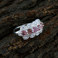 Eleanor silver multicolor gemstone ring with pink and clear stones on textured dark wood