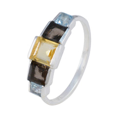 Putri multicolor gemstone ring with yellow center stone and blue and black accent stones in silver band