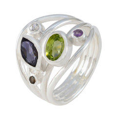 Liyana multicolor gemstone ring with silver band featuring green, purple, black, and clear stones