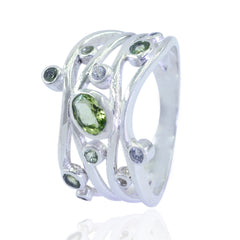 Rebeca multicolor gemstone statement ring with green and clear stones set in silver band