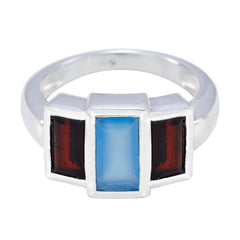 Florencia multicolor gemstone trilogy ring with blue center stone and two dark red side stones in silver band
