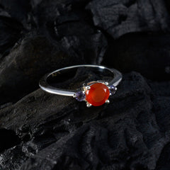 Kristine multicolor gemstone trilogy ring with a vibrant red center stone and two smaller purple gemstones on silver band