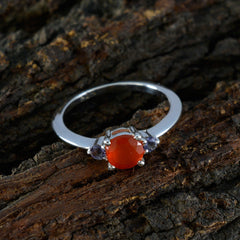 Silver multicolor gemstone trilogy ring with a central orange stone and two smaller purple stones