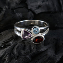 Siti multicolor gemstone trilogy ring with amethyst, blue topaz, and garnet stones set in silver band