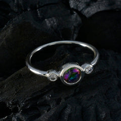 Soo-jin multicolor gemstone trilogy ring with a colorful center stone and two smaller clear stones in silver band