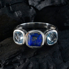 Luisa multicolor gemstone trilogy ring featuring a central blue stone flanked by two clear gemstones set in silver