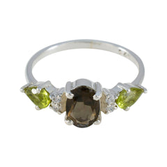 Naomi multicolor gemstone trilogy ring with green and brown gemstones on silver band