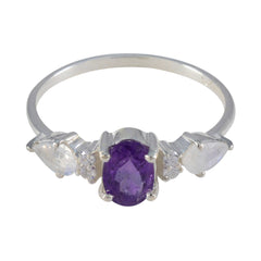 Nari multicolor gemstone trilogy ring featuring an oval purple center stone and two clear side gemstones