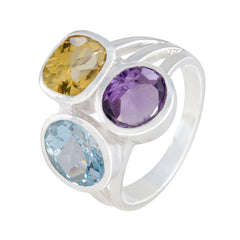 Putri multicolor gemstone trilogy ring with yellow, purple, and blue gemstones set in silver