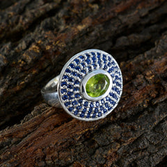 Putri multicolor halo cocktail ring with green center stone and blue pave halo on silver band
