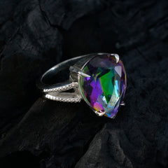 Maria multicolor heart solitaire ring with a vibrant faceted stone set in silver band on dark background