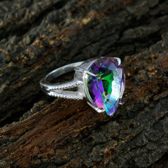 Maria multicolor heart solitaire ring with a vibrant multifaceted stone on textured bark background