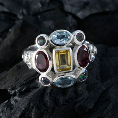 Multicolor Navratna cocktail ring by Maria with vibrant gemstones set in silver band