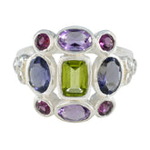 Greta multicolor Navratna cocktail ring sterling silver with central green stone and surrounding purple and pink gems
