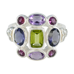 Greta multicolor Navratna cocktail ring sterling silver with central green stone and surrounding purple and pink gems