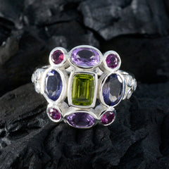 Greta multicolor Navratna cocktail ring silver setting with green center stone and purple pink accent gems
