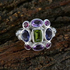 Greta multicolor Navratna cocktail ring with rectangular green center stone and purple pink gems in silver setting