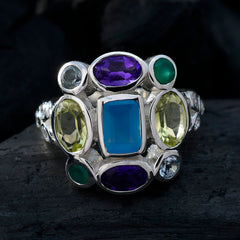 Genesis multicolor Navratna ring with central blue stone, amethyst purple, peridot and emerald accents in silver setting